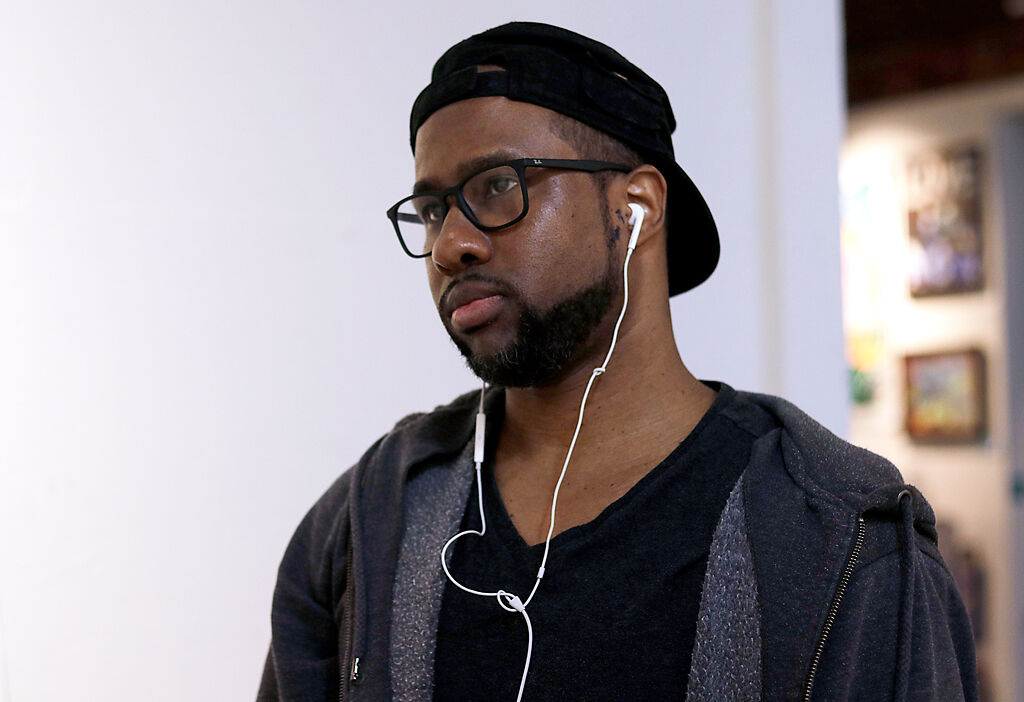 Askia Bilal examines his work in progress